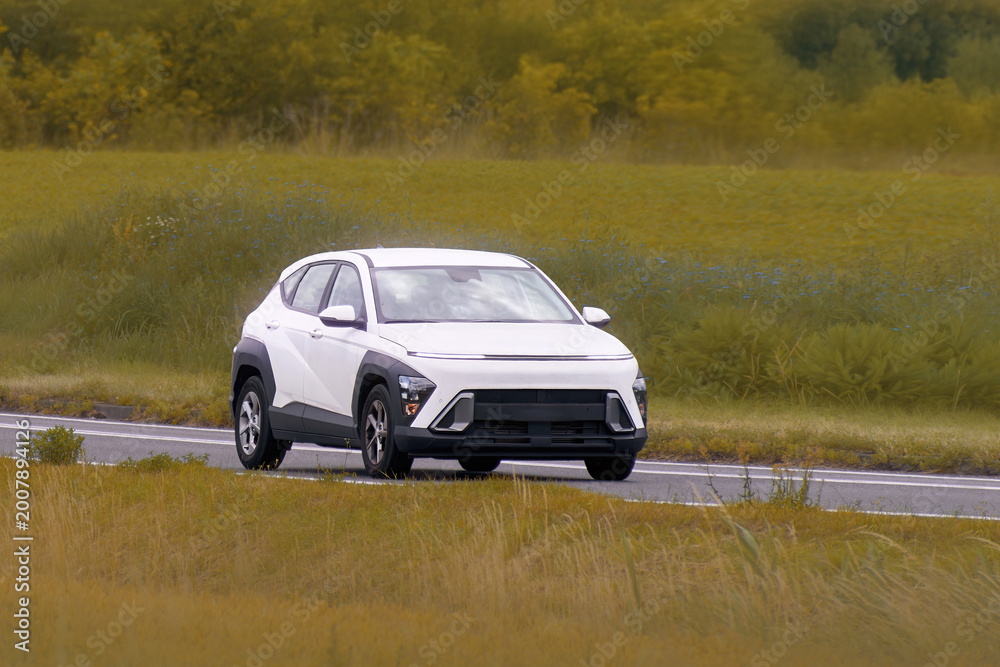Fototapeta premium Eco friendly electric SUV on scenic road