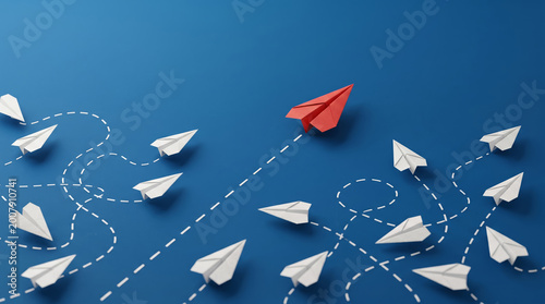 Red paper plane leading white ones on blue background, leadership and business guidance concept