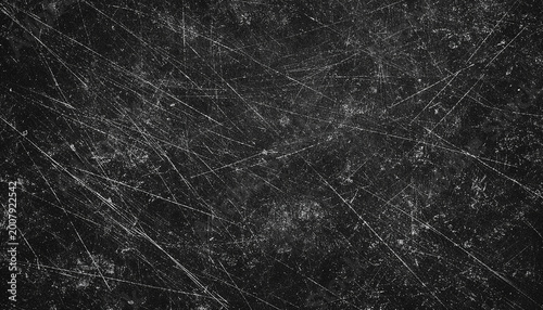 Fotografie Black scratched grunge background texture.