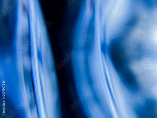 Abstract Blue Motion Blur with Flowing Light and Soft Vertical Movement