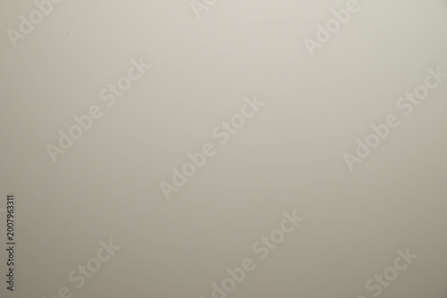 Softly Lit White Surface With Subtle Texture And Gentle Shadows