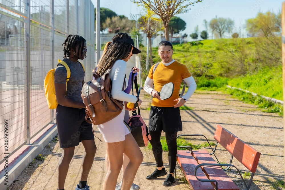 Fototapeta premium Friends arriving at pickleball court for game