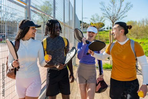 Cuadro en lienzo Diverse friends walking and laughing after playing pickleball