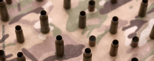 Tableau sur toile Big amount of shells cartridges from assault rifle bullets on old camouflage fab