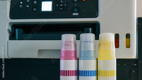 Quadro su tela Printer ink bottles ready for refilling a modern inkjet printer