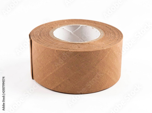 Roll of brown tape on a clean white surface