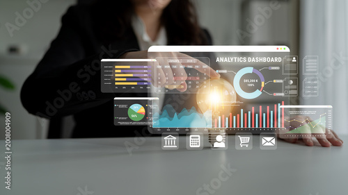 Quadro su tela Business professional interacting with advanced analytics dashboard displaying data insights and performance metrics in modern office setting Haptic
