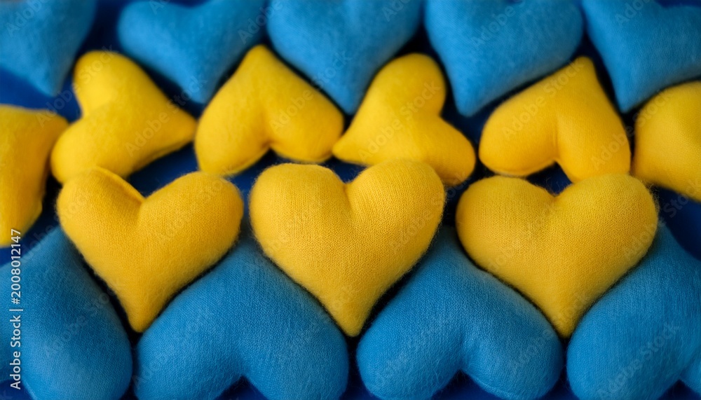 Obraz premium horizontal fluffy yellow and blue hearts fabric texture background for phone wallpapers