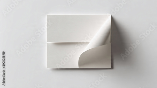 White envelope with curled flap on clean white background, top view, minimalist stationery mockup with subtle shadow, suitable for corporate