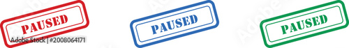Foto A collection of three rectangular stamps clearly showing the word PAUSED in red,