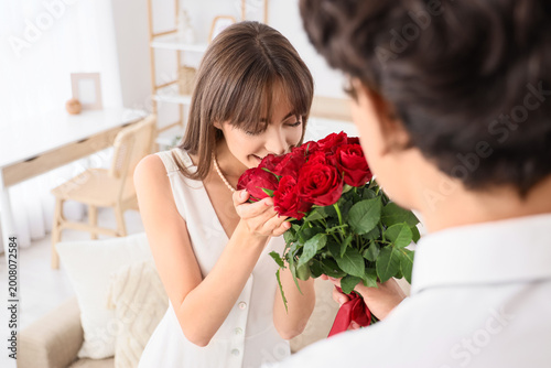Young woman receiving red r...