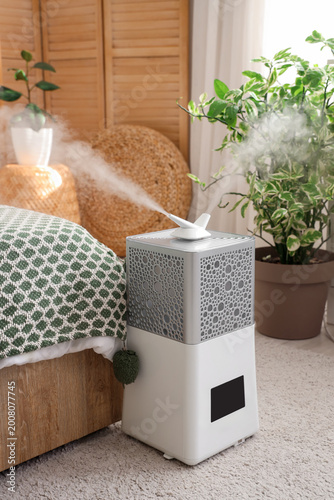 Modern humidifier on floor ...