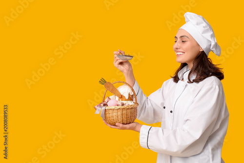 Happy female chef with East...
