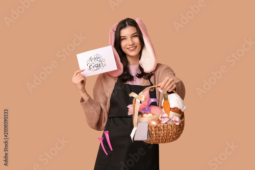 Happy female hairdresser in...