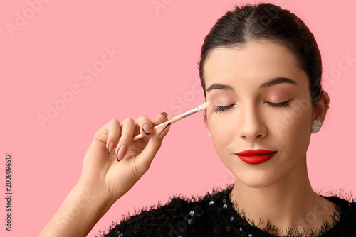 Beautiful young woman with ...