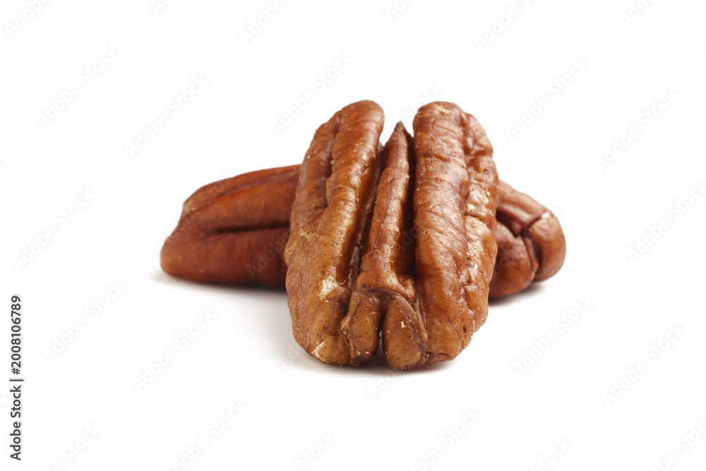 Fototapeta premium Shelled Pecans isolated on white background