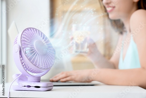 Small electric fan on table...