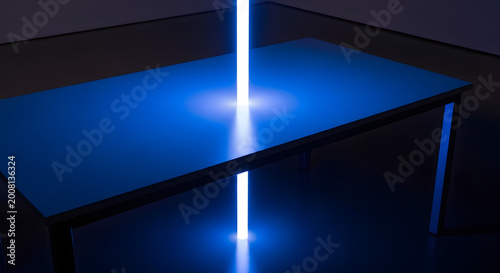 Bright blue light beam pierces through the center of a flat table surface creating a mysterious glow in a dark room with minimalist interior design