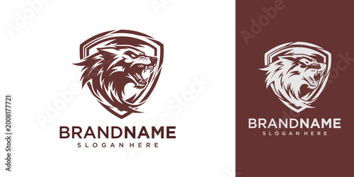 Bild auf Leinwand A logo of a lion's head in a shield, with the brand name and slogan below, on a white and dark brown background