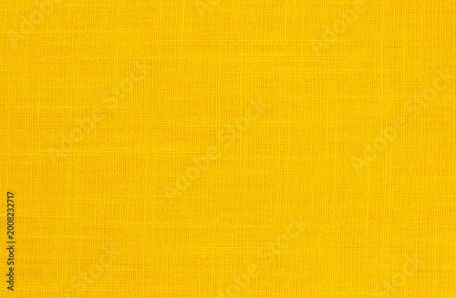 Yellow linen fabric cloth texture background, seamless pattern of natural textile.