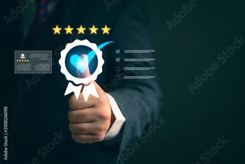Asia woman using smartphone for select smiley face icon for client evaluation and customer satisfaction after use product and service concept.