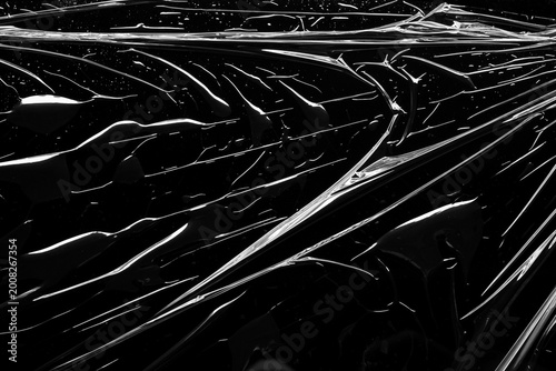 Fotografie transparent plastic film wrap overlay texture on black background