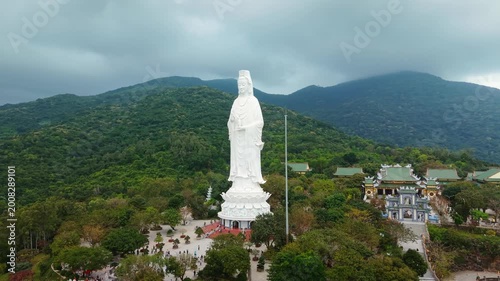 Lady Buddha statue in Linh Ung Pagoda Da Nang Vietnam stands tall overlooking sea and mountains. Spiritual icon Lady Buddha represents mercy peace and protection and attracts tourists and pilgrims.