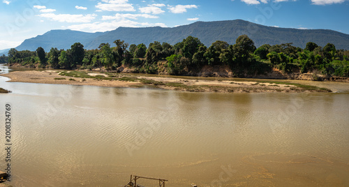 Bild auf Leinwand Panorama river plateau Xakhe Laos right angle view ferry crossing