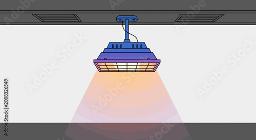 Industrial heat lamp illuminating a surface with warm orange light, overhead lighting fixture
