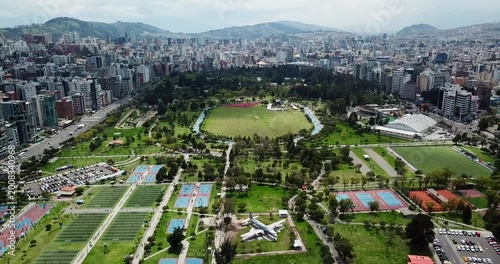 Aerial view of La Carolina Park with sports fields and urban activity in Quito Ecuador