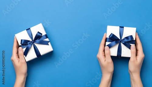 Red Ribbon Gift Box in Hands
