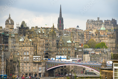 The historic skyline of Edinburgh, the capital of Scotland, featuring the North Bridge and Edinburgh Castle on Castle Rock