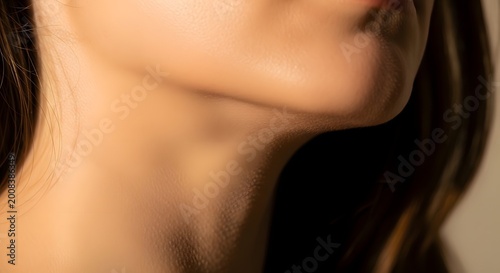 Close-up profile view of woman's neck and collarbone