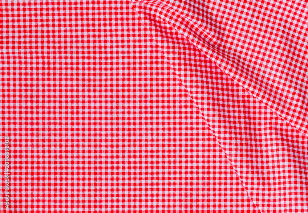 Naklejka premium A neat stack of folded red and white textured cotton fabric, soft lighting, minimalist top-down view, high quality textile photography. top view