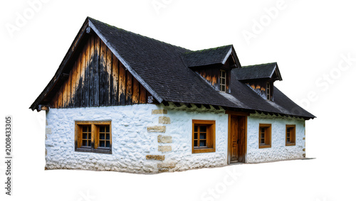 Foto Rustic stone and wood house with dark slate roof and dormer windows
