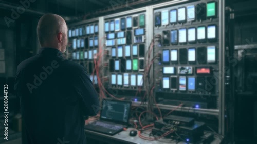 Technicians Supervise Organized Smartphone Groups In Controlled Environment With Detailed Analytics
