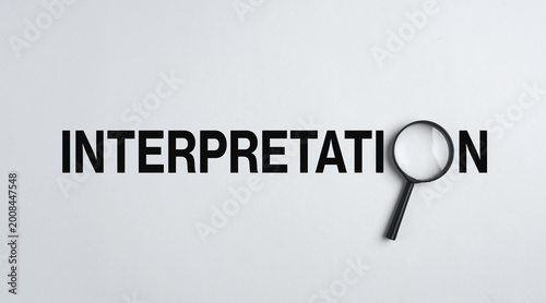 Magnifying glass exploring interpretation: deciphering meaning and understanding
