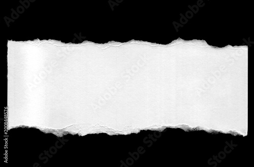 Horizontal white torn paper strip banner with ragged edges on black background 