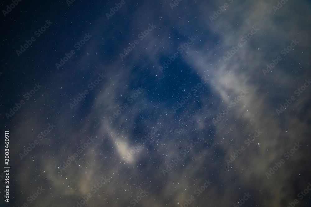 Obraz premium Starry Night Sky with Wispy white Clouds layer