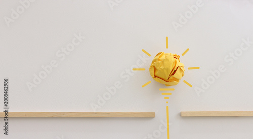 Education concept image. Creative idea and innovation. Crumpled paper as light bulb metaphor