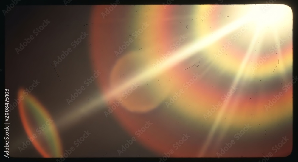 Obraz premium Bright Sunlight with Lens Flare and Rainbow Effects in the Sky.