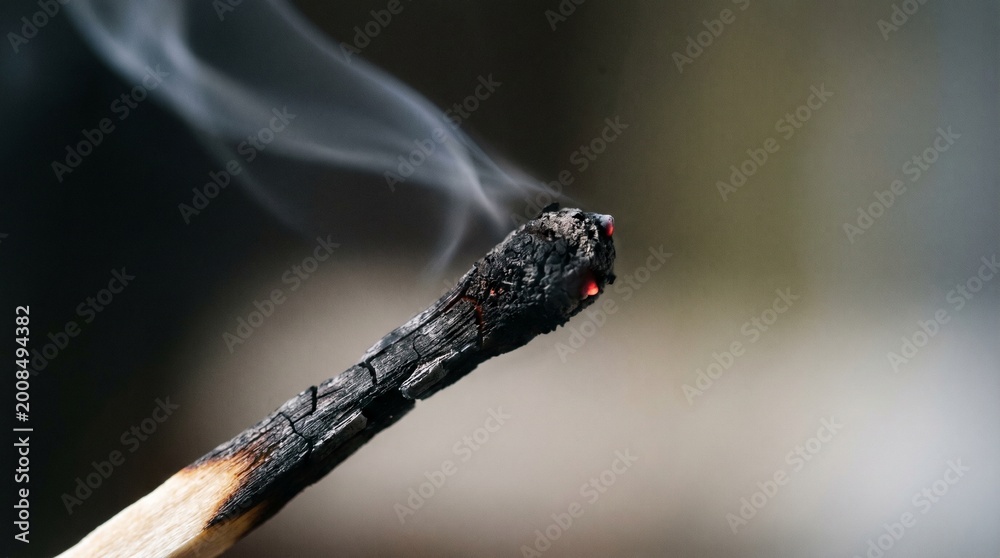 Obraz premium Macro blown out match grey smoke