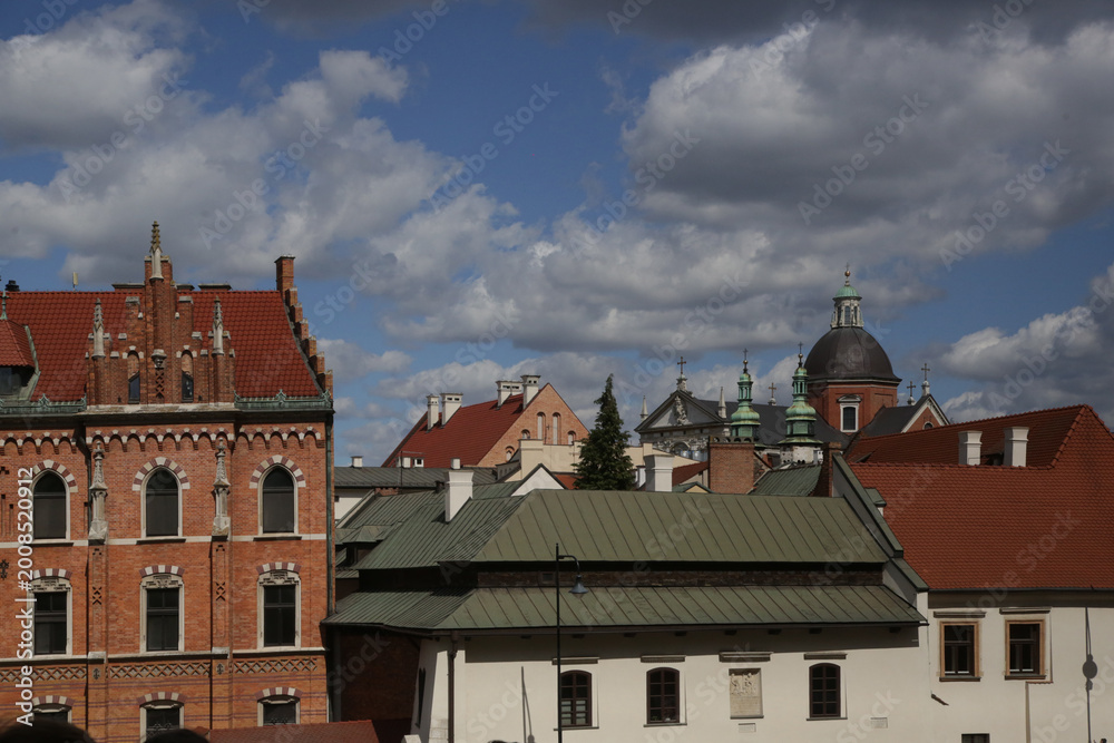 Obraz premium Elegant Historic Rooftops and Facades in the Old Town of Kraków