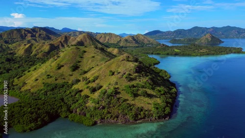 Komodo island landscape with boats in turquoise water. Best aerial view drone