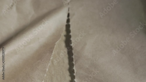 Tear brown paper detail