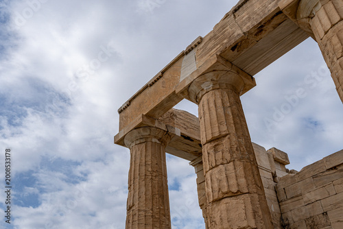 Close-up of the monumental Propylaea gateway in Athens, featuring Doric columns and stone entablature. Iconic Greek architecture at the Acropolis.