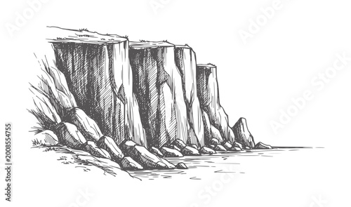 Foto Of towering cliffs meeting the sea with rocky shore coast