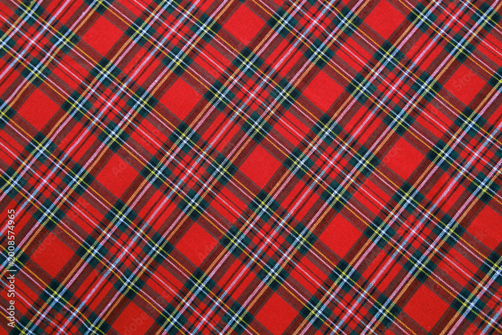 Plaid diagonal pattern, red, green, black, yellow, white, seamless for textiles and design clothing, skirts, pants, aprons, tablecloths, blankets or decorative fabrics. Vector illustration.