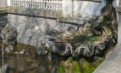 Fragment of Triton Fountain shows stone details near Königsallee in Düsseldorf, Germany