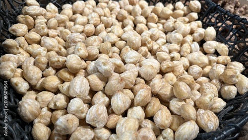 close up of roasted candle nuts spices